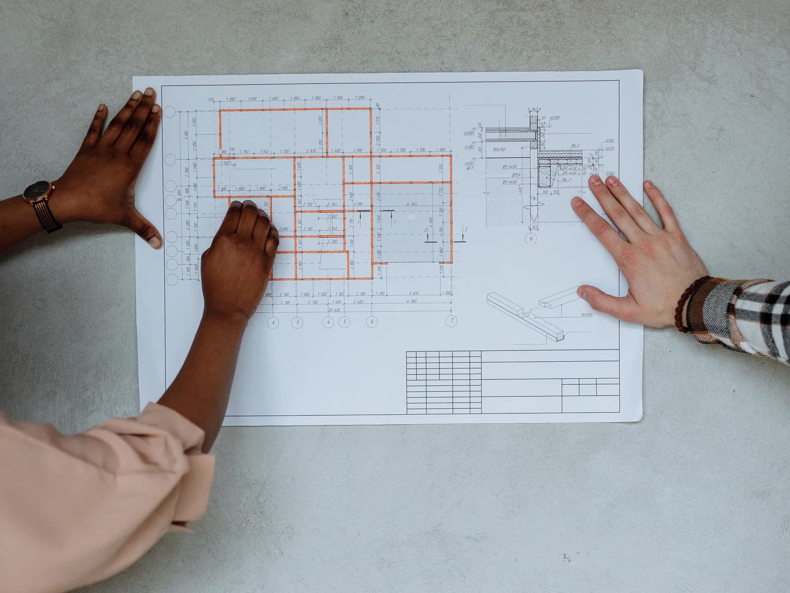Property floor plan being reviewed on a table